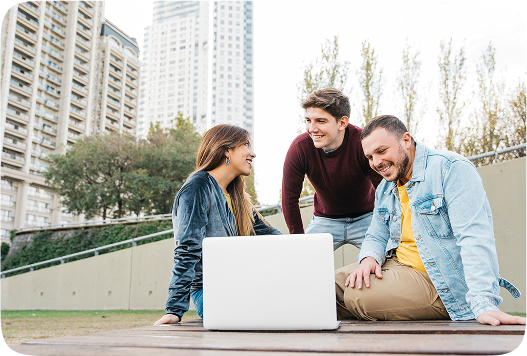 hero three people smiling to a laptop